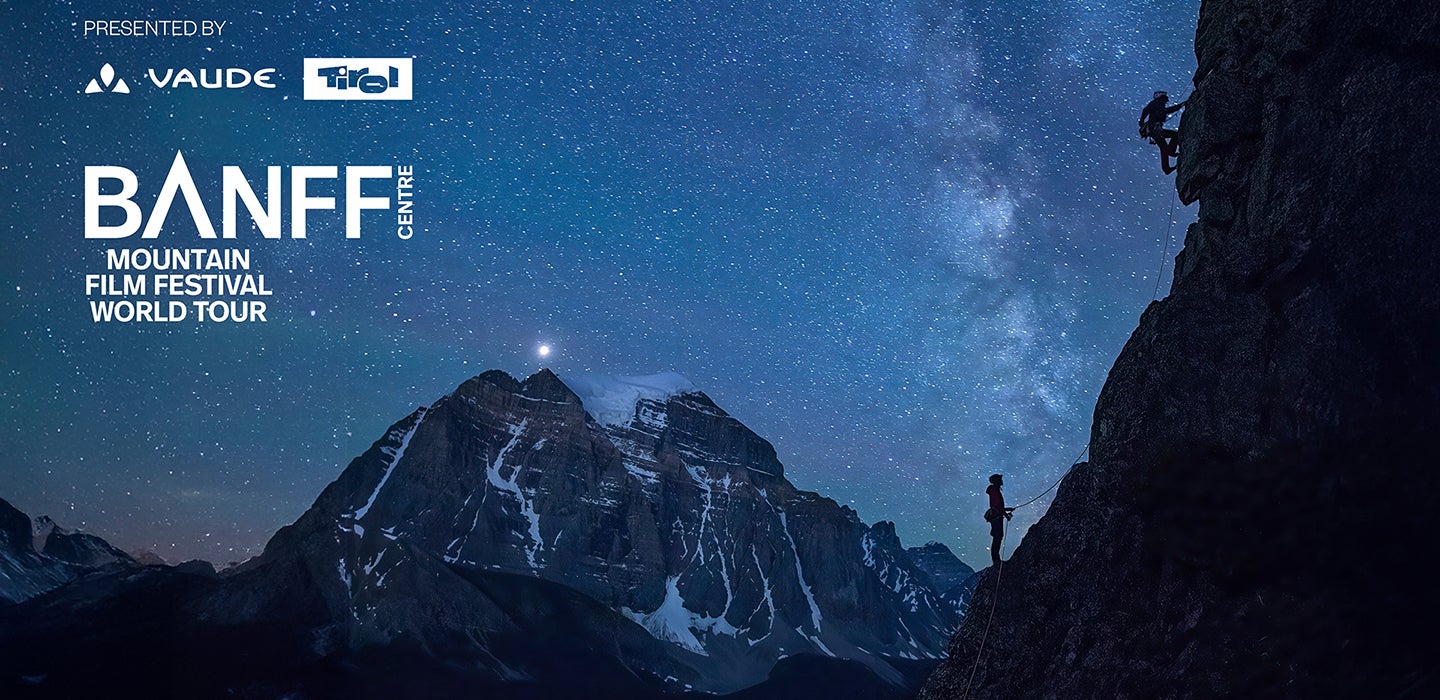 Two climbers scale a mountain under startlight Copyright Banff National Park photo by Paul Zizka